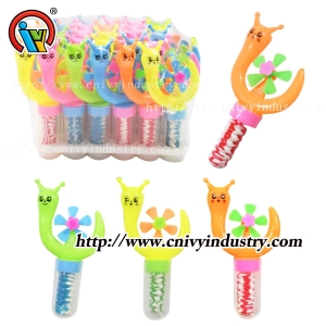 Продаётся леденец на палочке в форме улитки и ветряной мельницы